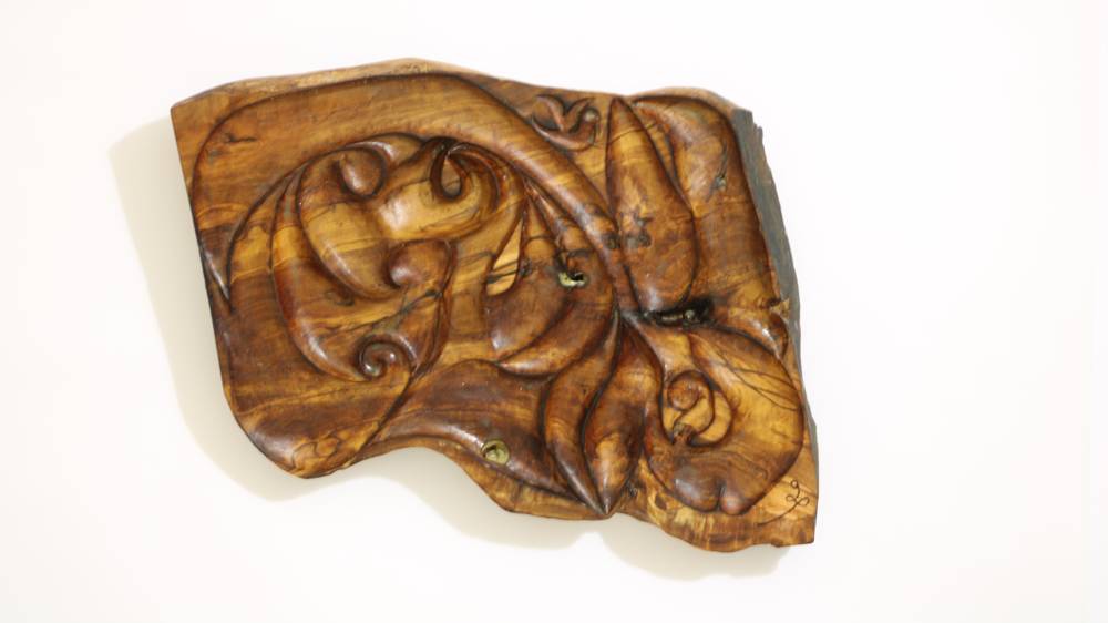 Khaled Zaghdoud carves messages of peace and coexistence on olive wood