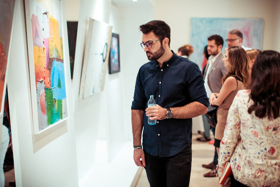 Spectators at the Bridges Exhibition at the KAICIID Dialogue Centre. Photo: David Pan. Spectators at the Bridges Exhibition at the KAICIID Dialogue Centre. Photo: David Pan.