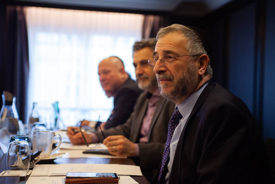 Jewish and Muslim leaders sit next to each other at a KAICIID event