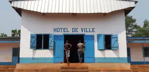 A bold push for peace: Two men stand in front of the Hotel De Ville in the Central African Republic
