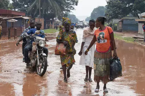 Residents walk down a street in the PK5 district in Bangui, Central African Republic