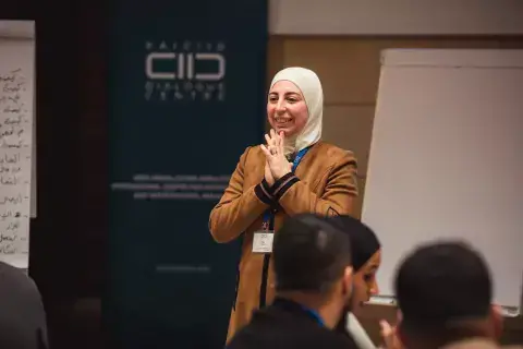 KAICIID Fellow Dr. Rania Alayoubi speaks at a KAICIID training 