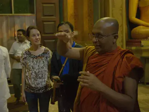 The final stop on the tour was the Bellanwila Buddhist Temple. The tour was led by Galkande Dhammananda Thero, a graduate of the first Fellows course. Dhammananda is a Buddhist monk working in peacebuilding and reconciliation in Colombo. Dhammananda Conducts the Tour