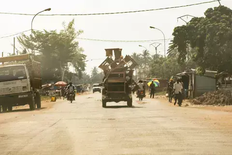 An overloaded truck hauls furniture down a central street in Bangui. Photo: Kaleb Warnock/KAICIID