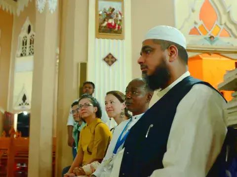 Fellows Observe a Presentation on the Church