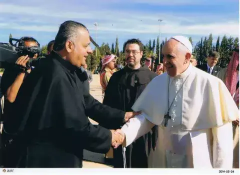 Father Rifat Bader welcomes Pope Francis to Jordan in 2014 Father Rifat Bader welcomes Pope Francis to Jordan in 2014