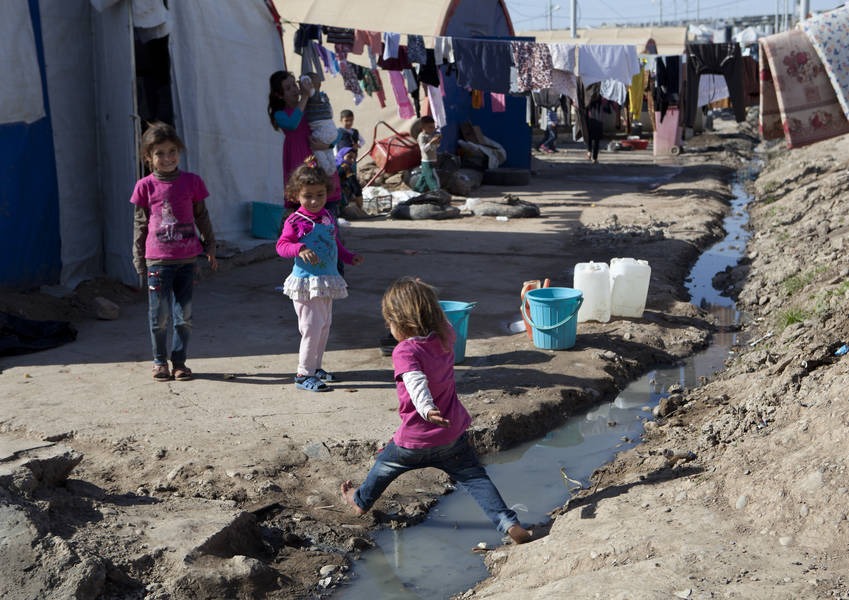 Children at the Bajed Kandala camp close to the Syrian border, a dusty, ill-equipped camp in northern Iraq. Yazidis fleeing a jihadist offensive say members of their families - men, women and even babies - have been abducted by militants.