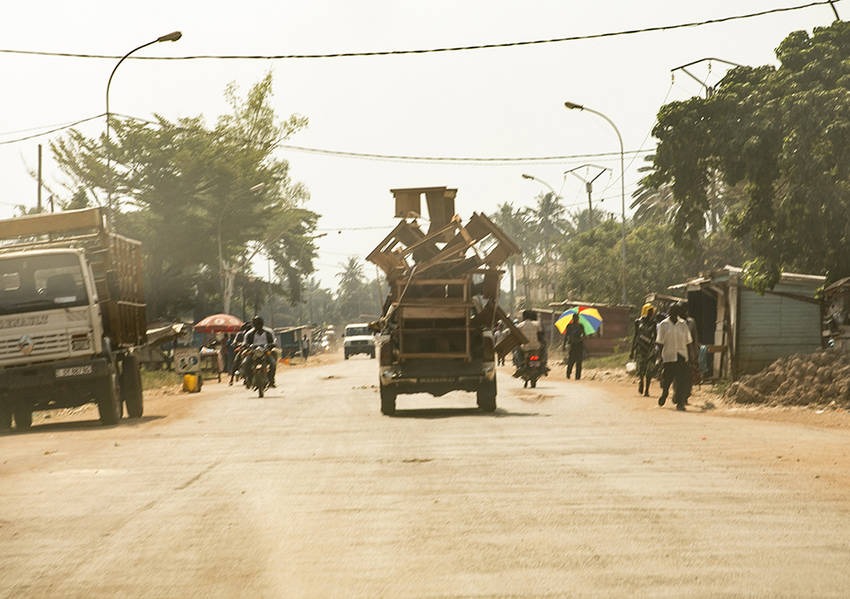 An overloaded truck hauls furniture down a central street in Bangui. Photo: Kaleb Warnock/KAICIID