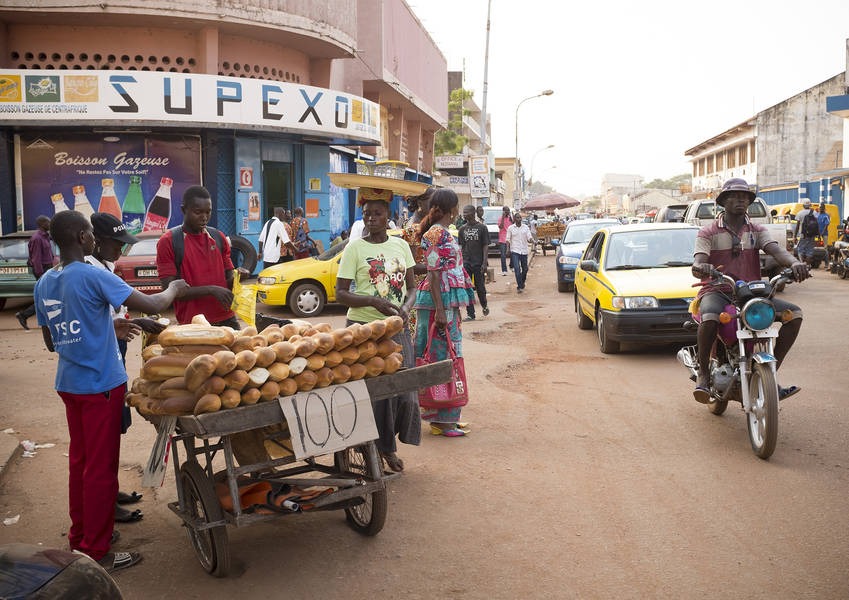 A man sells baguettes from a rickshaw – a common sight in the Bangui city centre. Photo: Kaleb Warnock/KAICIID