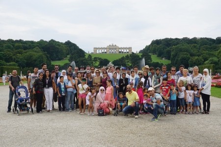 Programme participants stand before the Gloriette, a Viennese landmark located at the Schönbrunn palace in Vienna, Austria. Schonbrunn