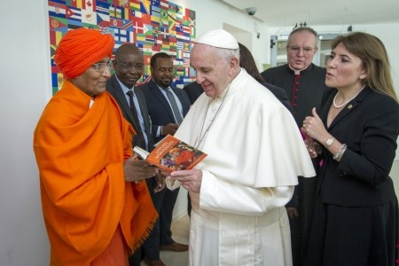 Board Member Swami Agnivesh presents a copy of his book to H.H Pope Francis. Photo: Swami Agnivesh Board Member Swami Agnivesh presents a copy of his book to H.H Pope Francis. Photo: Swami Agnivesh